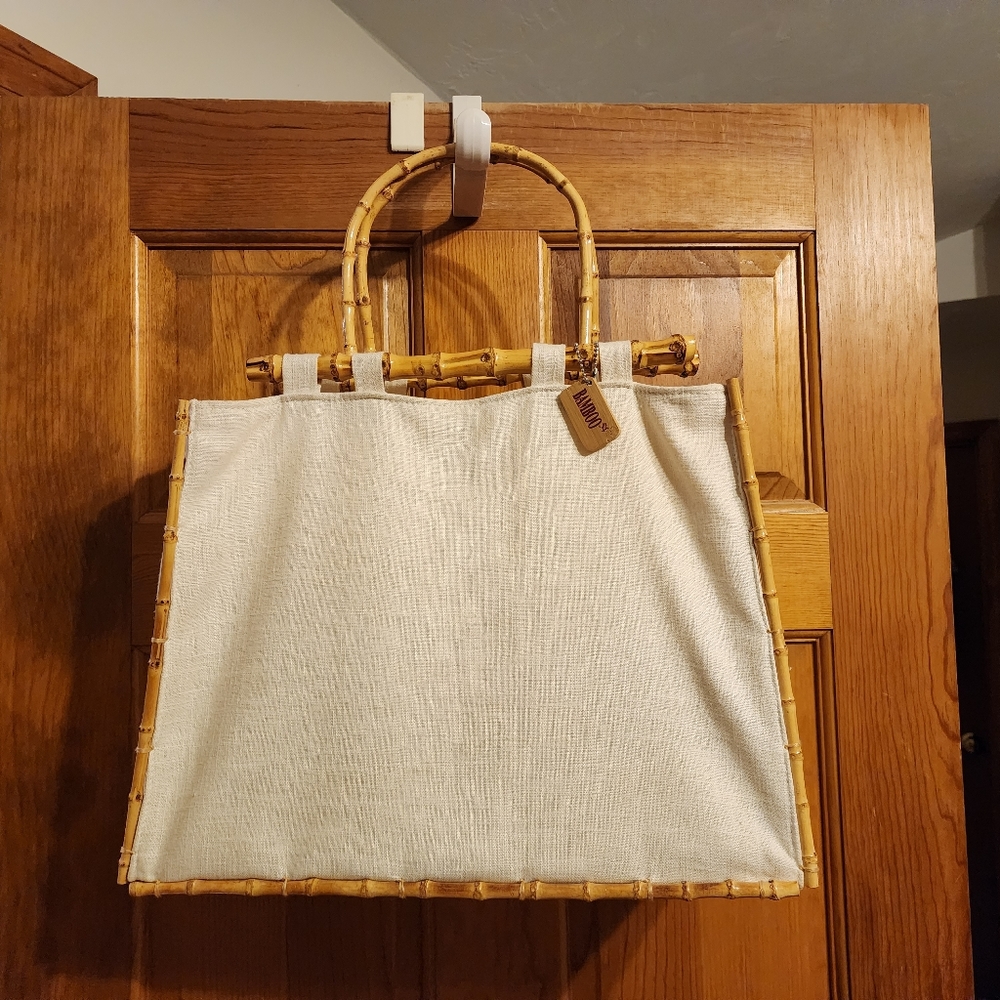 Off White Linen totebag, by "Bamboo 54", w bamboo handle, measures 16 3/4" x 12.